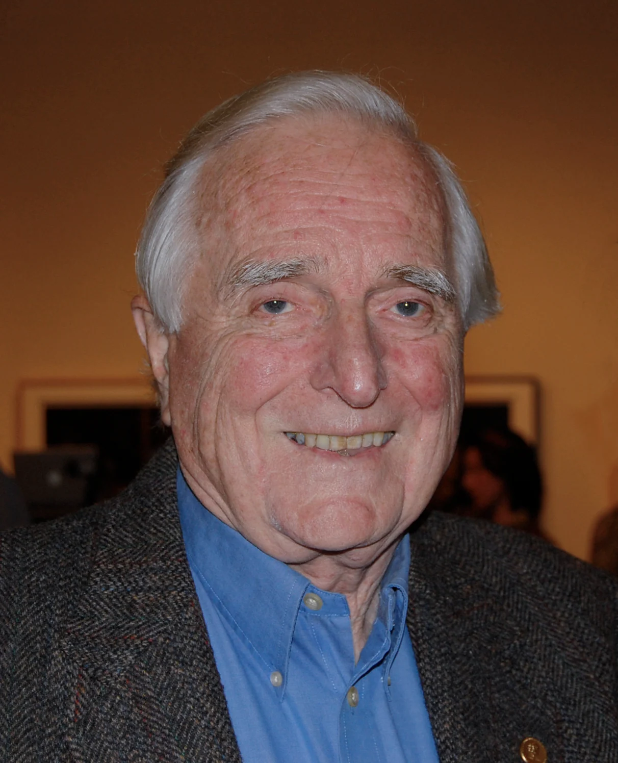 Douglas Engelbart in 2008, white-haired, listening at a conference.
