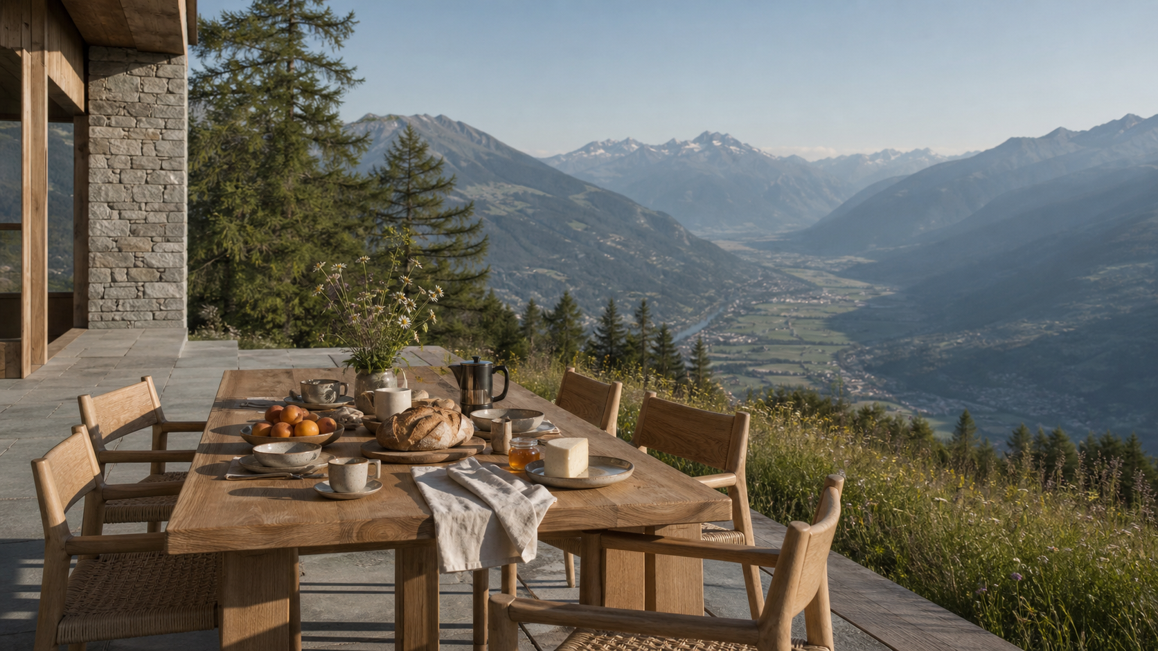 Summer breakfast laid on Chalet Solaire's south terrace above the Rhône valley.