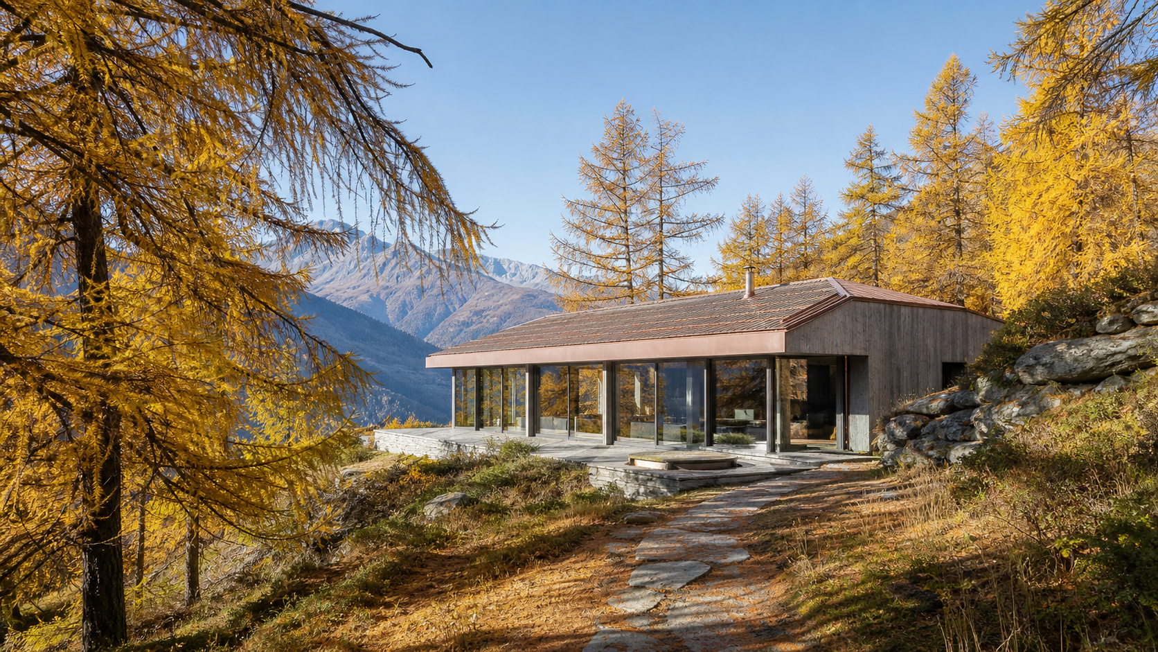 Chalet Solaire among golden larches on a clear October afternoon.